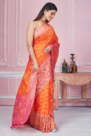 Shop orange Banarasi saree online in USA with heavy zari minakari border. Look your best on festive occasions in latest designer saris, pure silk sarees, Kanjivaram silk sarees, handwoven saris, tussar silk sarees, embroidered saris from Pure Elegance Indian fashion store in USA.-side