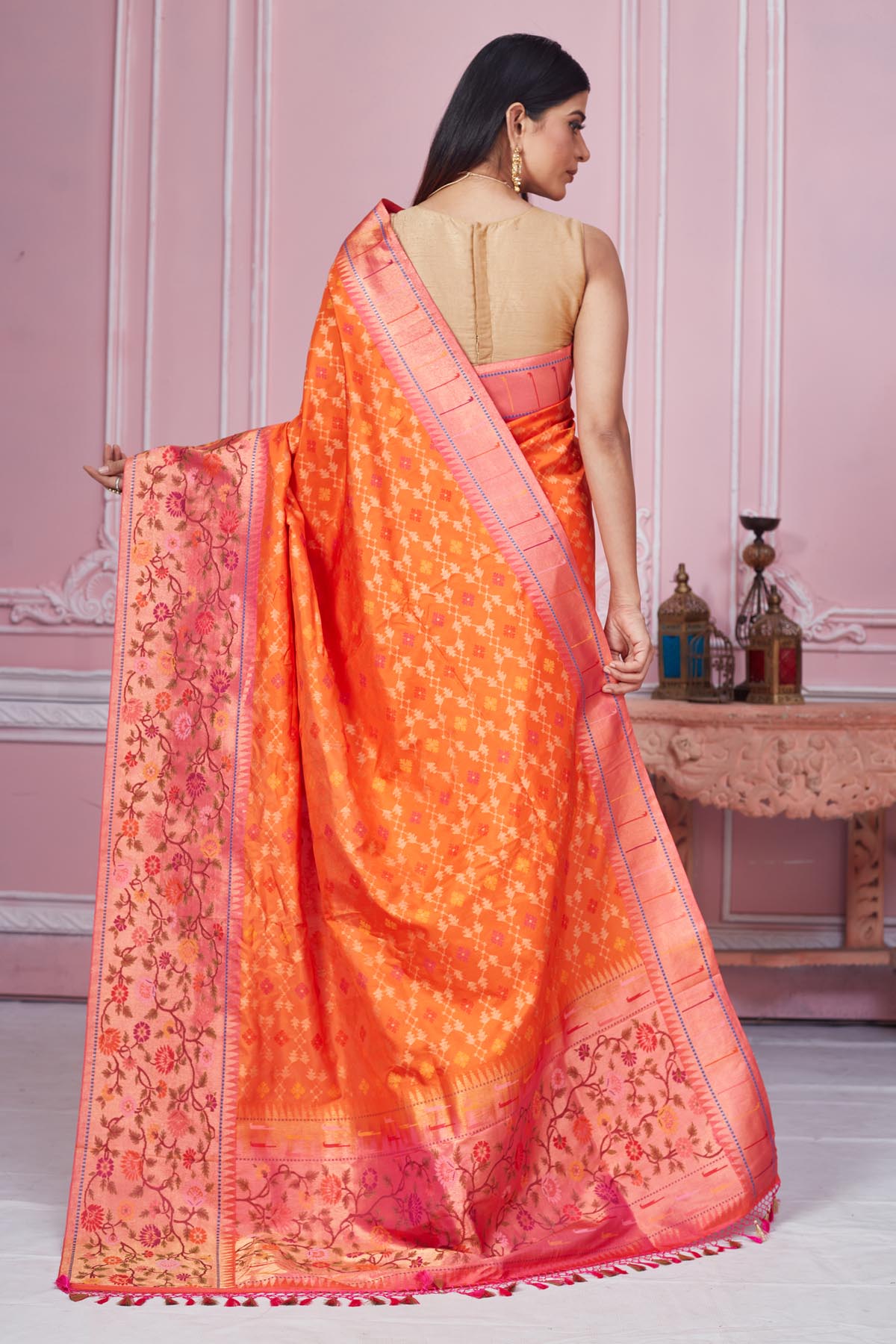 Shop orange Banarasi saree online in USA with heavy zari minakari border. Look your best on festive occasions in latest designer saris, pure silk sarees, Kanjivaram silk sarees, handwoven saris, tussar silk sarees, embroidered saris from Pure Elegance Indian fashion store in USA.-back