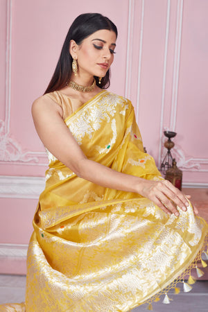 Shop yellow Banarasi saree online in USA with zari minakari work. Look your best on festive occasions in latest designer saris, pure silk sarees, Kanjivaram silk sarees, handwoven saris, tussar silk sarees, embroidered saris from Pure Elegance Indian fashion store in USA.-closeup
