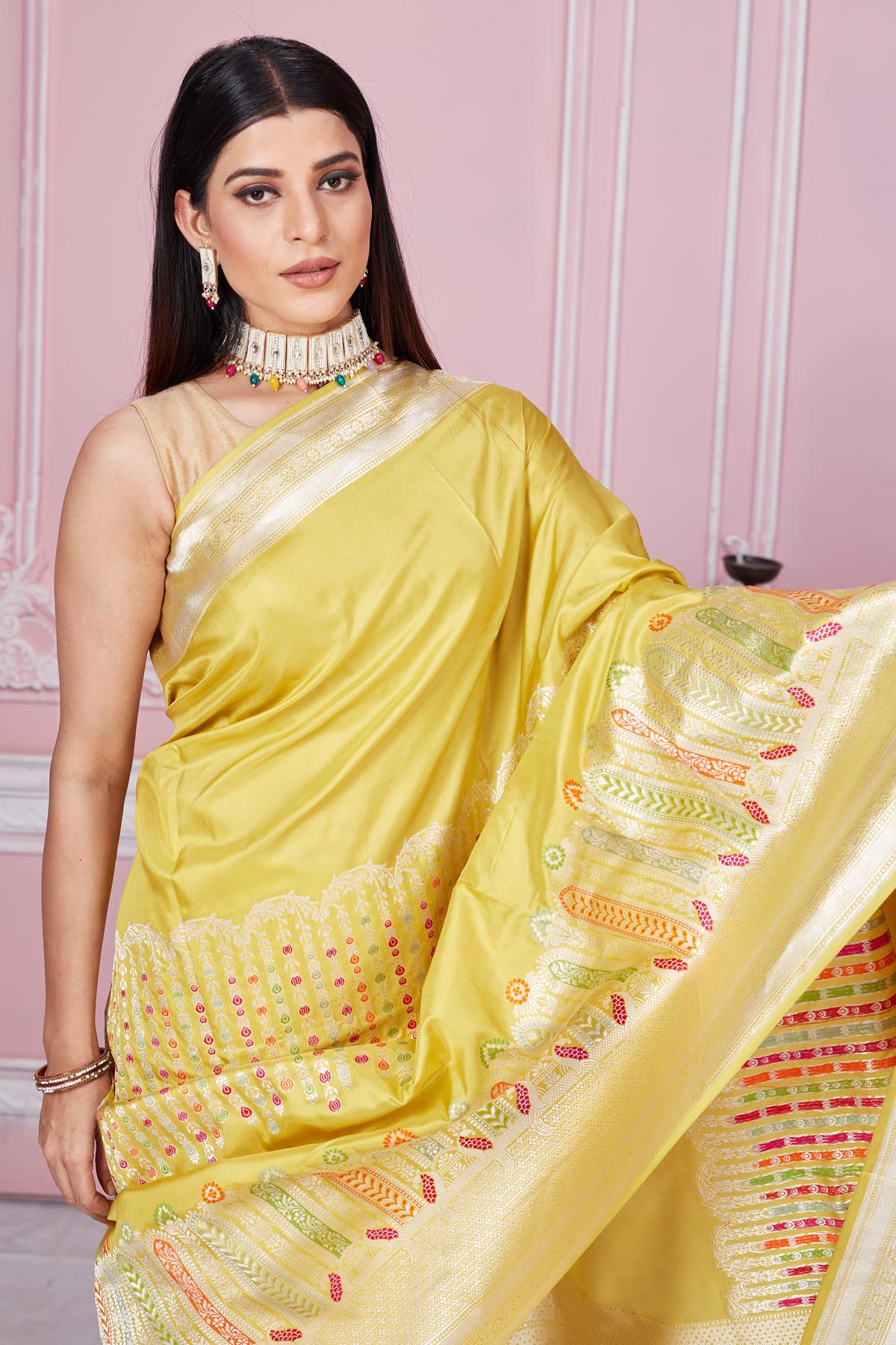 Buy stunning yellow Banarasi sari online in USA with zari minakari border. Look your best on festive occasions in latest designer saris, pure silk sarees, Kanjivaram silk sarees, handwoven saris, tussar silk sarees, embroidered saris from Pure Elegance Indian fashion store in USA.-closeup