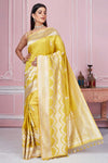 Shop yellow Banarasi sari online in USA with zari minakari buta. Look your best on festive occasions in latest designer saris, pure silk sarees, Kanjivaram silk sarees, handwoven saris, tussar silk sarees, embroidered saris from Pure Elegance Indian fashion store in USA.-full view