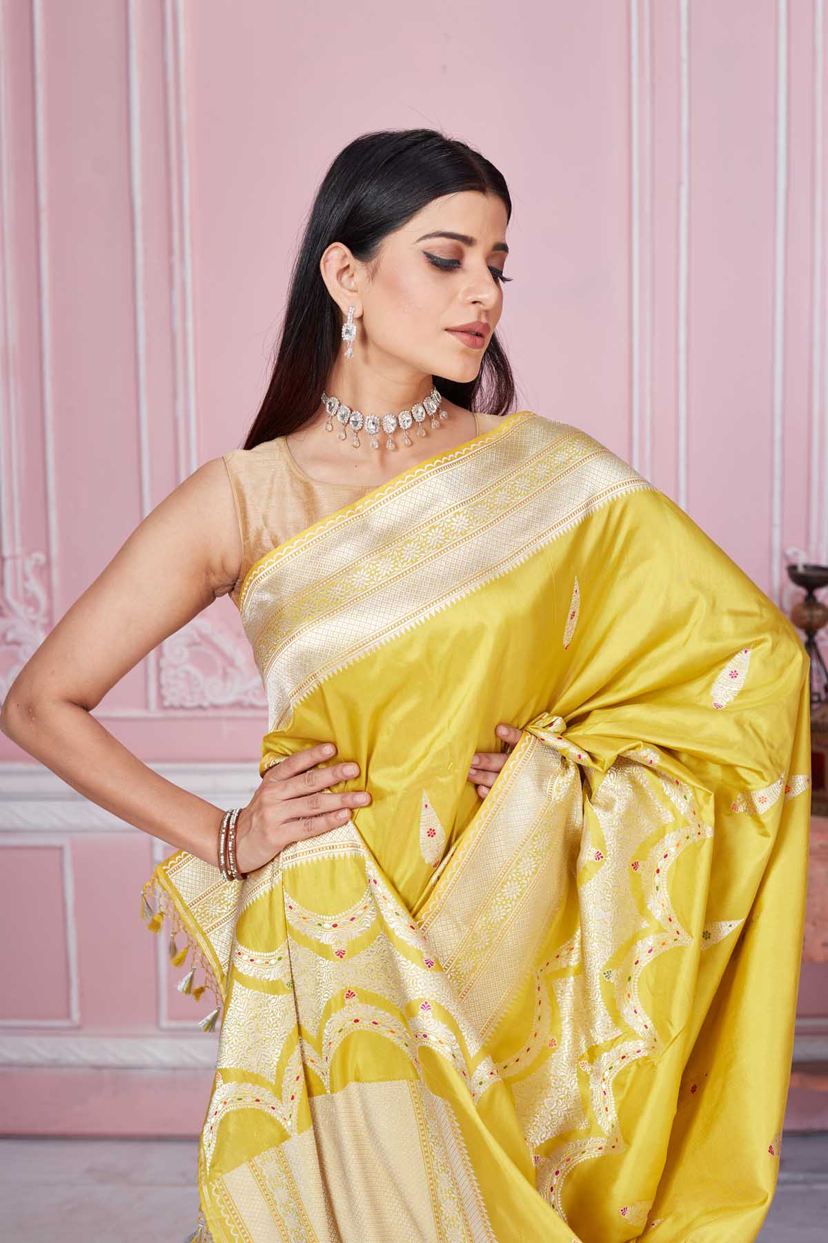 Shop yellow Banarasi sari online in USA with zari minakari buta. Look your best on festive occasions in latest designer saris, pure silk sarees, Kanjivaram silk sarees, handwoven saris, tussar silk sarees, embroidered saris from Pure Elegance Indian fashion store in USA.-closeup