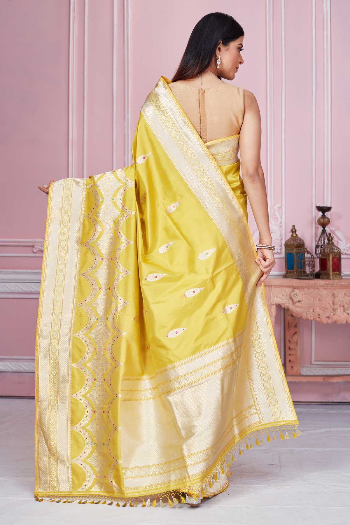 Shop yellow Banarasi sari online in USA with zari minakari buta. Look your best on festive occasions in latest designer saris, pure silk sarees, Kanjivaram silk sarees, handwoven saris, tussar silk sarees, embroidered saris from Pure Elegance Indian fashion store in USA.-back
