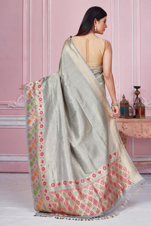 Buy grey Banarasi sari online in USA with zari minakari border. Look your best on festive occasions in latest designer saris, pure silk sarees, Kanjivaram silk sarees, handwoven saris, tussar silk sarees, embroidered saris from Pure Elegance Indian fashion store in USA.-back