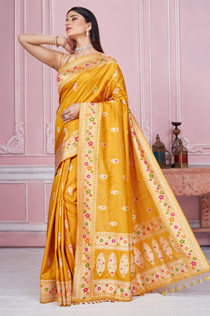 Shop beautiful mustard Banarasi sari online in USA with zari minakari border. Look your best on festive occasions in latest designer saris, pure silk sarees, Kanjivaram silk sarees, handwoven saris, tussar silk sarees, embroidered saris from Pure Elegance Indian fashion store in USA.-pallu