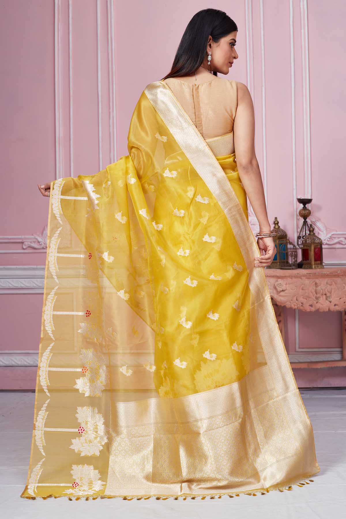 Buy beautiful yellow Banarasi sari online in USA with golden zari border and pallu. Look your best on festive occasions in latest designer saris, pure silk sarees, Kanjivaram silk sarees, handwoven saris, tussar silk sarees, embroidered saris from Pure Elegance Indian fashion store in USA.-back