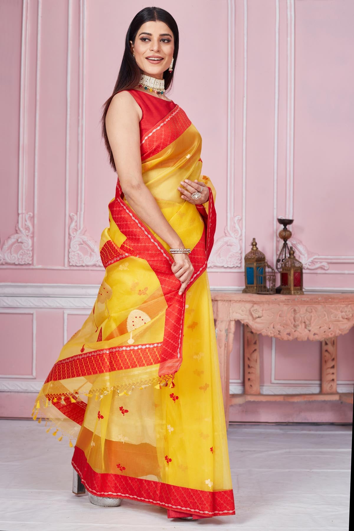 Shop yellow Banarasi sari online in USA with scattered red buti. Look your best on festive occasions in latest designer saris, pure silk sarees, Kanjivaram silk sarees, handwoven saris, tussar silk sarees, embroidered saris from Pure Elegance Indian fashion store in USA.-side