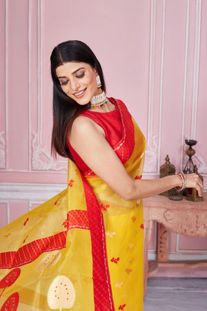 Shop yellow Banarasi sari online in USA with scattered red buti. Look your best on festive occasions in latest designer saris, pure silk sarees, Kanjivaram silk sarees, handwoven saris, tussar silk sarees, embroidered saris from Pure Elegance Indian fashion store in USA.-saree