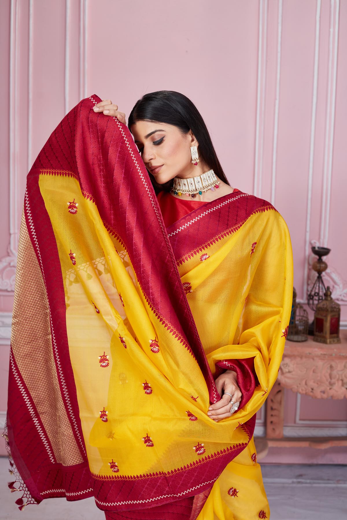 Buy yellow Banarasi saree online in USA with red border and zari pallu. Look your best on festive occasions in latest designer saris, pure silk sarees, Kanjivaram silk sarees, handwoven saris, tussar silk sarees, embroidered saris from Pure Elegance Indian fashion store in USA.-closeup