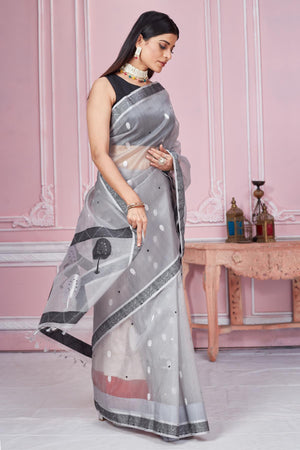 Buy beautiful light grey Banarasi saree online in USA with scattered buti. Look your best on festive occasions in latest designer saris, pure silk sarees, Kanjivaram silk sarees, handwoven saris, tussar silk sarees, embroidered saris from Pure Elegance Indian fashion store in USA.-side