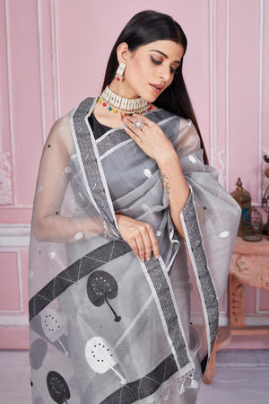 Buy beautiful light grey Banarasi saree online in USA with scattered buti. Look your best on festive occasions in latest designer saris, pure silk sarees, Kanjivaram silk sarees, handwoven saris, tussar silk sarees, embroidered saris from Pure Elegance Indian fashion store in USA.-closeup