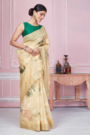 Shop stunning cream floral print Banarasi saree online in USA. Look your best on festive occasions in latest designer sarees, pure silk saris, Kanchipuram silk sarees, handwoven sarees, tussar silk saris, embroidered sarees from Pure Elegance Indian fashion store in USA.-side