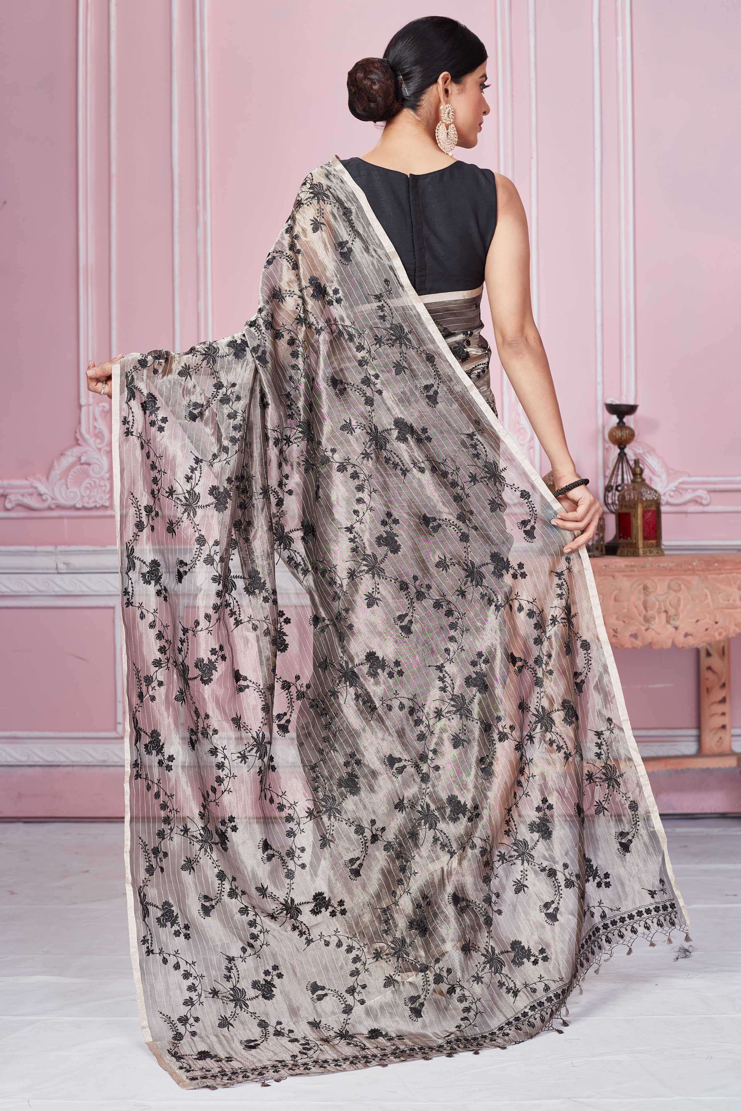 Shop stunning metallic grey floral Banarasi saree online in USA. Look your best on festive occasions in latest designer sarees, pure silk saris, Kanchipuram silk sarees, handwoven sarees, tussar silk saris, embroidered sarees from Pure Elegance Indian fashion store in USA.-back