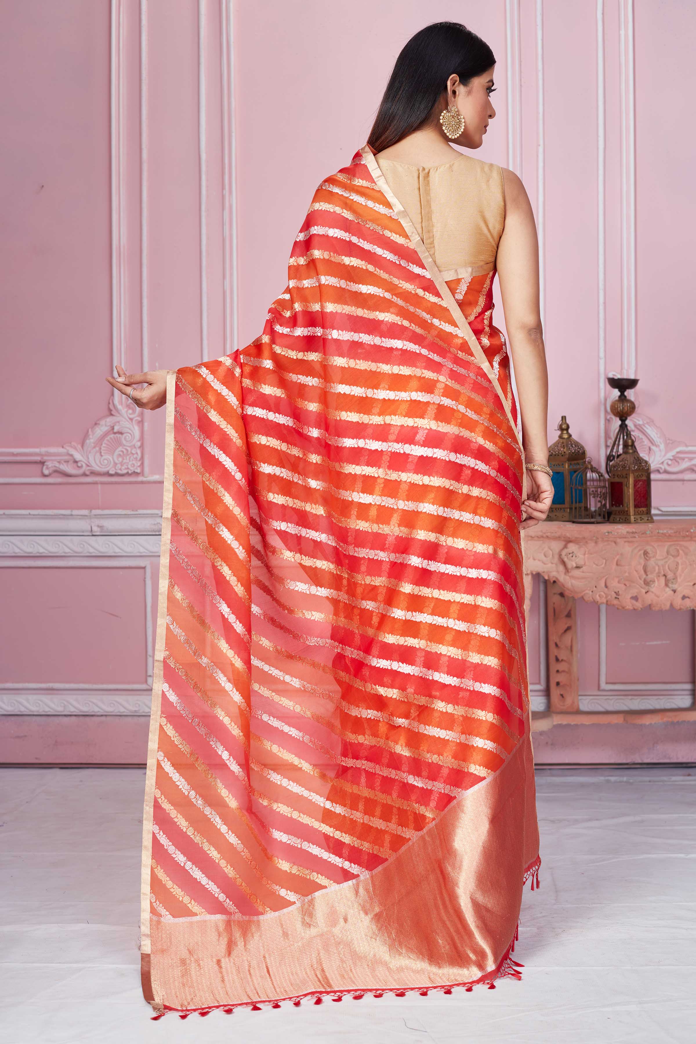 Shop red orange zari stripes Banarasi saree online in USA. Look your best on festive occasions in latest designer sarees, pure silk saris, Kanchipuram silk sarees, handwoven sarees, tussar silk saris, embroidered sarees from Pure Elegance Indian fashion store in USA.-back