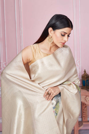 Buy beige floral Banarasi saree online in USA with zari border. Look your best on festive occasions in latest designer sarees, pure silk saris, Kanchipuram silk sarees, handwoven sarees, tussar silk saris, embroidered sarees from Pure Elegance Indian fashion store in USA.-closeup