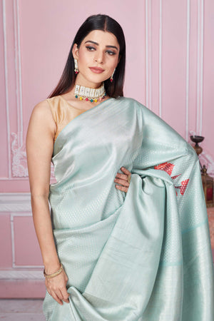 Shop sage green Banarasi saree online in USA with red floral design. Look your best on festive occasions in latest designer sarees, pure silk saris, Kanchipuram silk sarees, handwoven sarees, tussar silk saris, embroidered sarees from Pure Elegance Indian fashion store in USA.-closeup