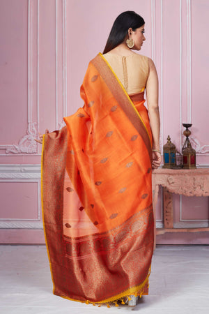 Shop orange Banarasi saree online in USA with red zari border. Look your best on festive occasions in latest designer sarees, pure silk saris, Kanchipuram silk sarees, handwoven sarees, tussar silk saris, embroidered sarees from Pure Elegance Indian fashion store in USA.-back