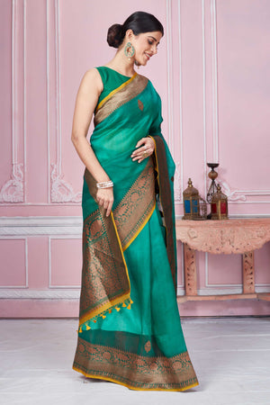 Buy green Banarasi saree online in USA with antique zari border. Look your best on festive occasions in latest designer sarees, pure silk saris, Kanchipuram silk sarees, handwoven sarees, tussar silk saris, embroidered sarees from Pure Elegance Indian fashion store in USA.-side