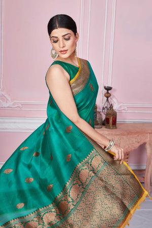 Buy green Banarasi saree online in USA with antique zari border. Look your best on festive occasions in latest designer sarees, pure silk saris, Kanchipuram silk sarees, handwoven sarees, tussar silk saris, embroidered sarees from Pure Elegance Indian fashion store in USA.-closeup