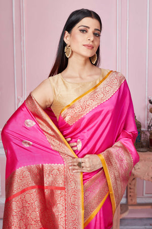 Buy pink Banarasi sari online in USA with antique zari border. Look your best on festive occasions in latest designer sarees, pure silk saris, Kanchipuram silk sarees, handwoven sarees, tussar silk saris, embroidered sarees from Pure Elegance Indian fashion store in USA.-closeup