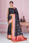 Shop black Banarasi sari online in USA with pink zari border. Look your best on festive occasions in latest designer sarees, pure silk saris, Kanchipuram silk sarees, handwoven sarees, tussar silk saris, embroidered sarees from Pure Elegance Indian fashion store in USA.-full view