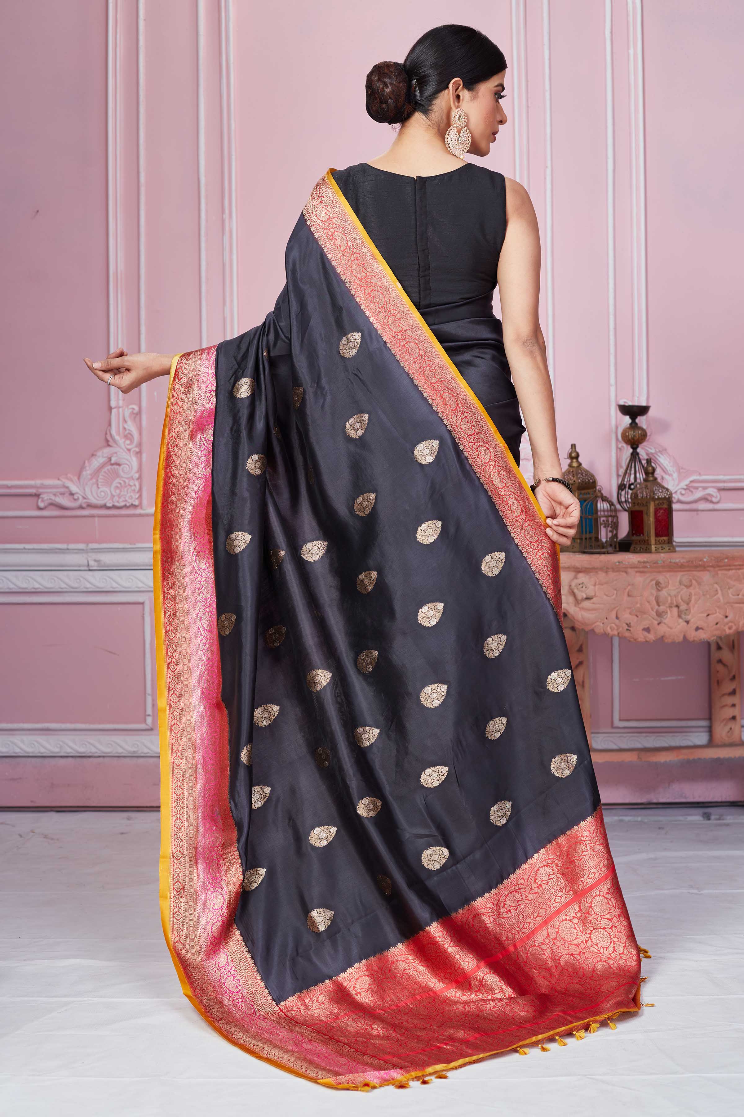 Shop black Banarasi sari online in USA with pink zari border. Look your best on festive occasions in latest designer sarees, pure silk saris, Kanchipuram silk sarees, handwoven sarees, tussar silk saris, embroidered sarees from Pure Elegance Indian fashion store in USA.-back