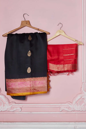 Shop black Banarasi sari online in USA with pink zari border. Look your best on festive occasions in latest designer sarees, pure silk saris, Kanchipuram silk sarees, handwoven sarees, tussar silk saris, embroidered sarees from Pure Elegance Indian fashion store in USA.-blouse