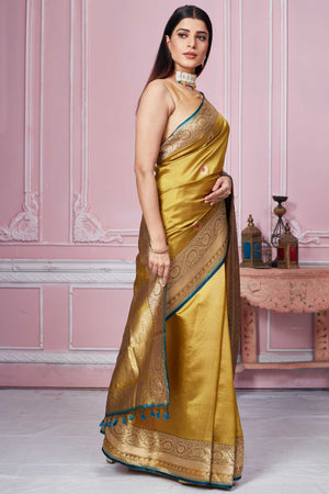 Buy golden Banarasi sari online in USA with zari minakari buta. Look your best on festive occasions in latest designer sarees, pure silk saris, Kanchipuram silk sarees, handwoven sarees, tussar silk saris, embroidered sarees from Pure Elegance Indian fashion store in USA.-side