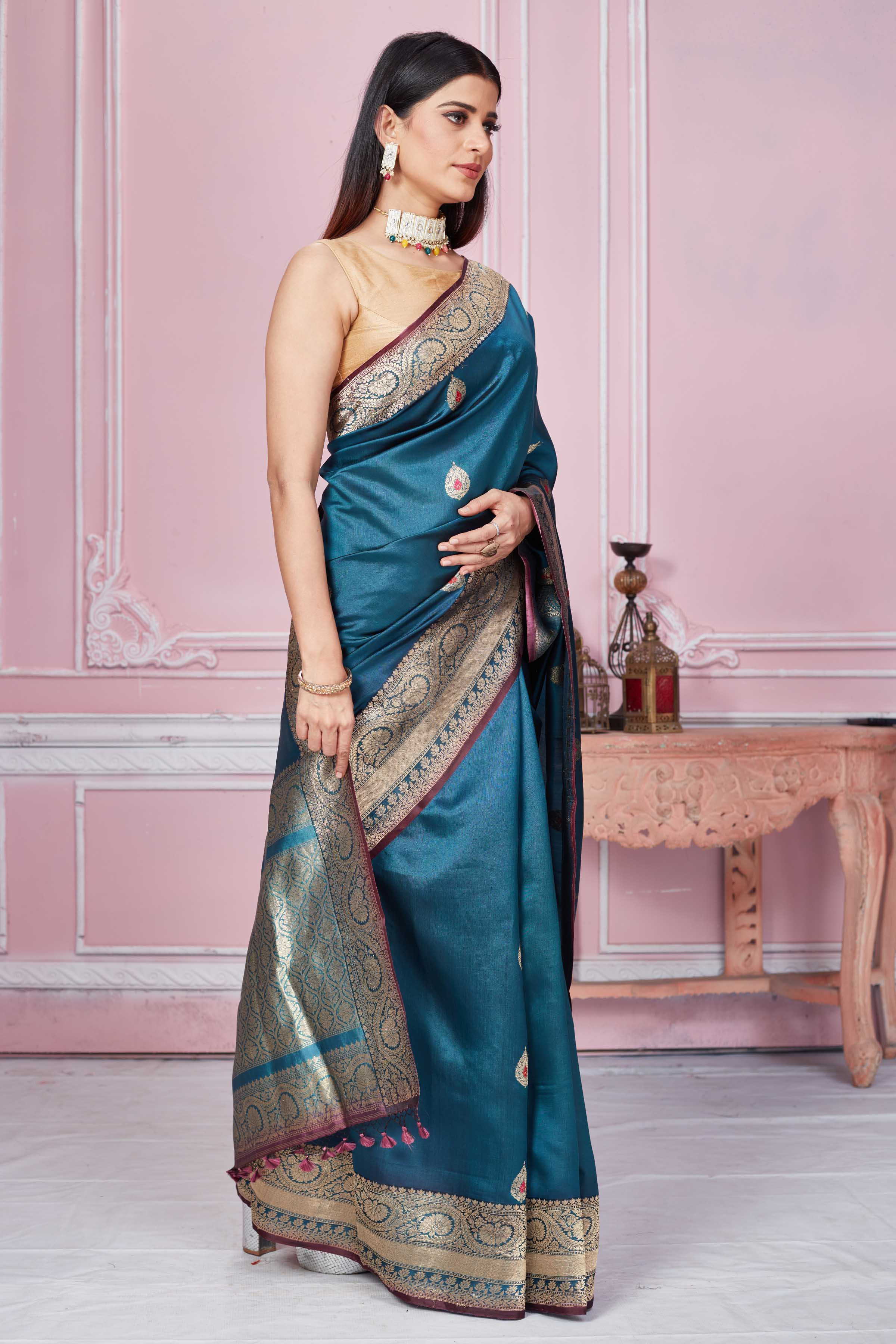 Shop stunning teal Banarasi sari online in USA with zari minakari buta. Look your best on festive occasions in latest designer sarees, pure silk saris, Kanchipuram silk sarees, handwoven sarees, tussar silk saris, embroidered sarees from Pure Elegance Indian fashion store in USA.-side