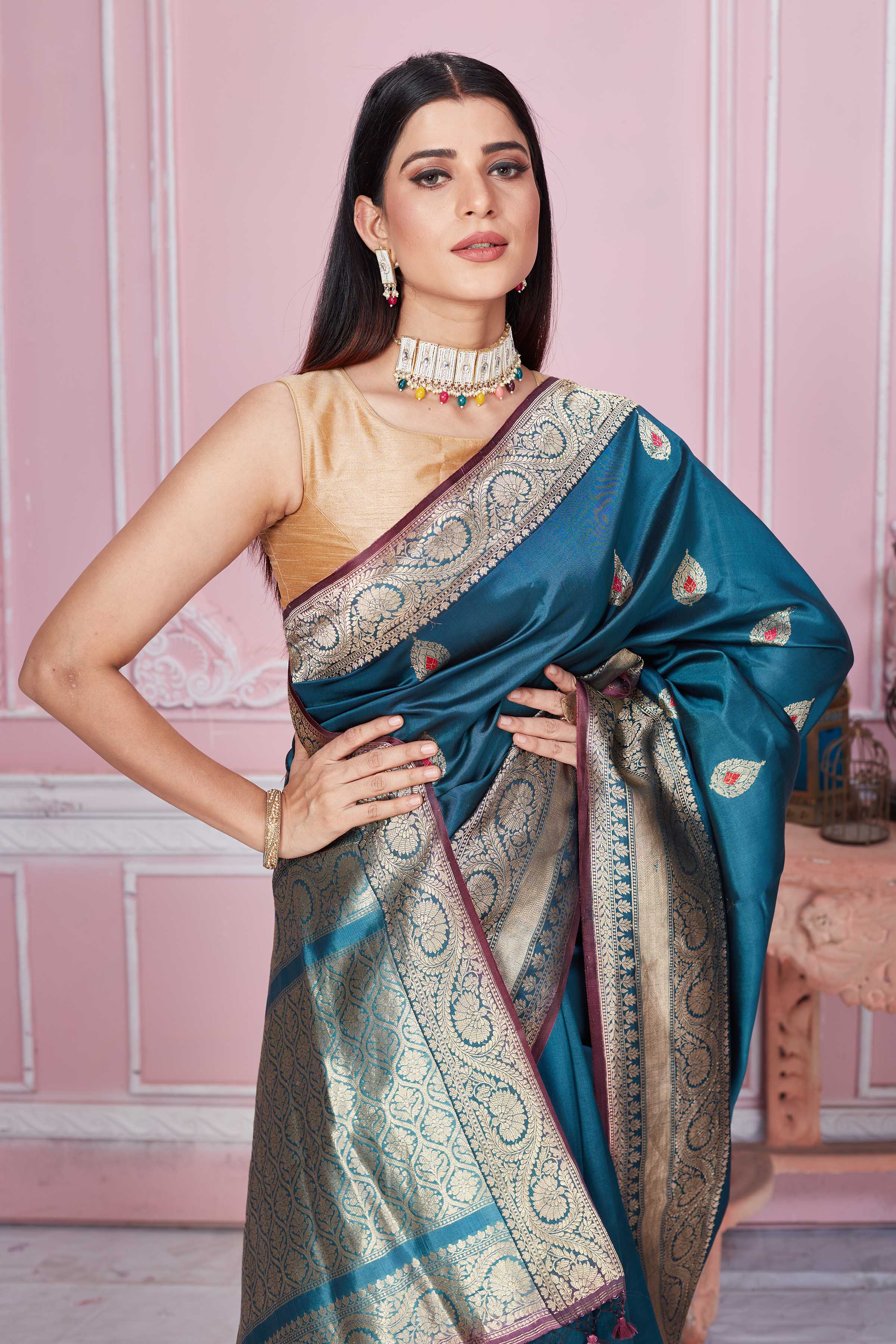Shop stunning teal Banarasi sari online in USA with zari minakari buta. Look your best on festive occasions in latest designer sarees, pure silk saris, Kanchipuram silk sarees, handwoven sarees, tussar silk saris, embroidered sarees from Pure Elegance Indian fashion store in USA.-closeup