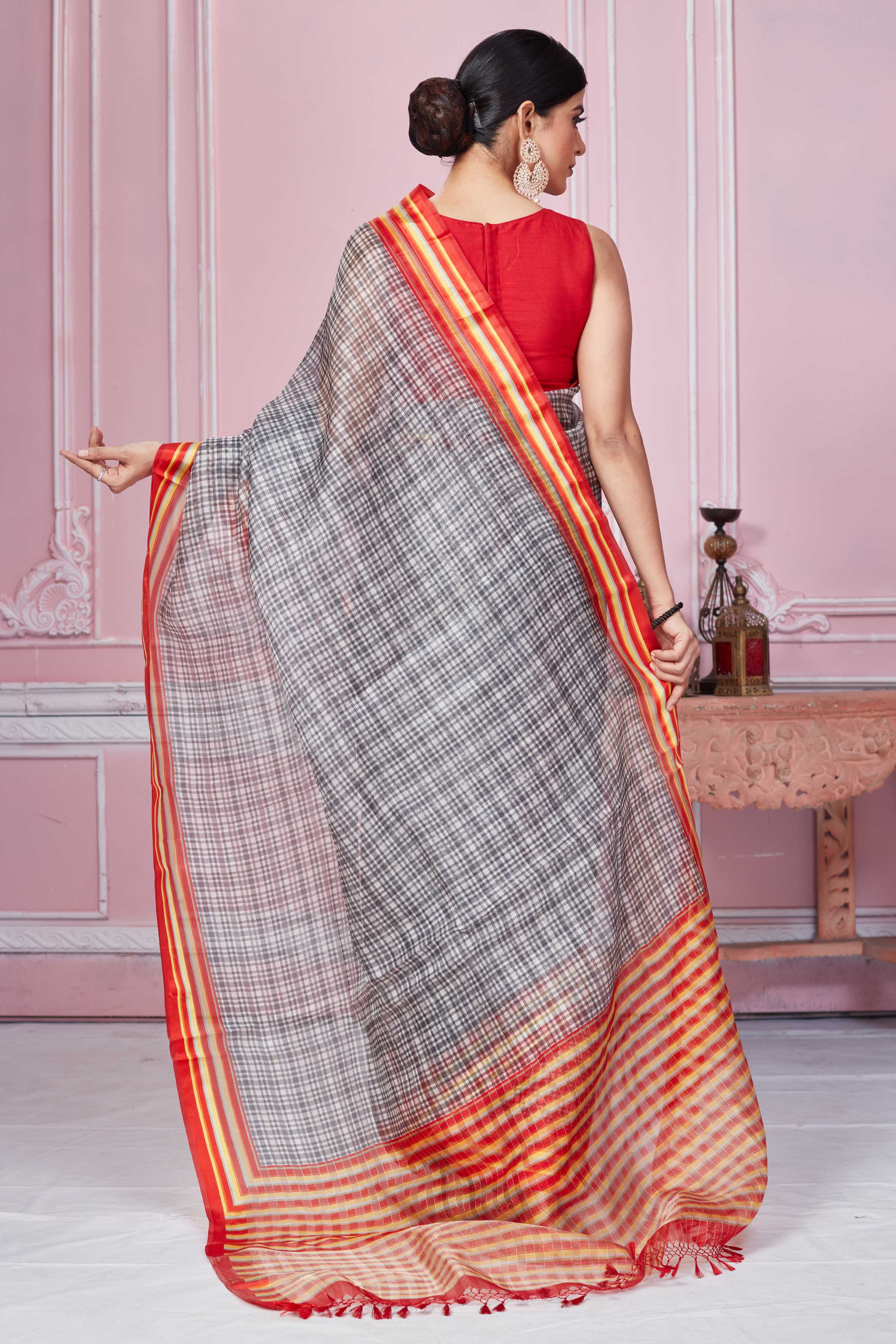 Buy grey check organza sari online in USA with red striped border. Look your best on festive occasions in latest designer sarees, pure silk saris, Kanchipuram silk sarees, handwoven sarees, tussar silk saris, embroidered sarees from Pure Elegance Indian fashion store in USA.-back