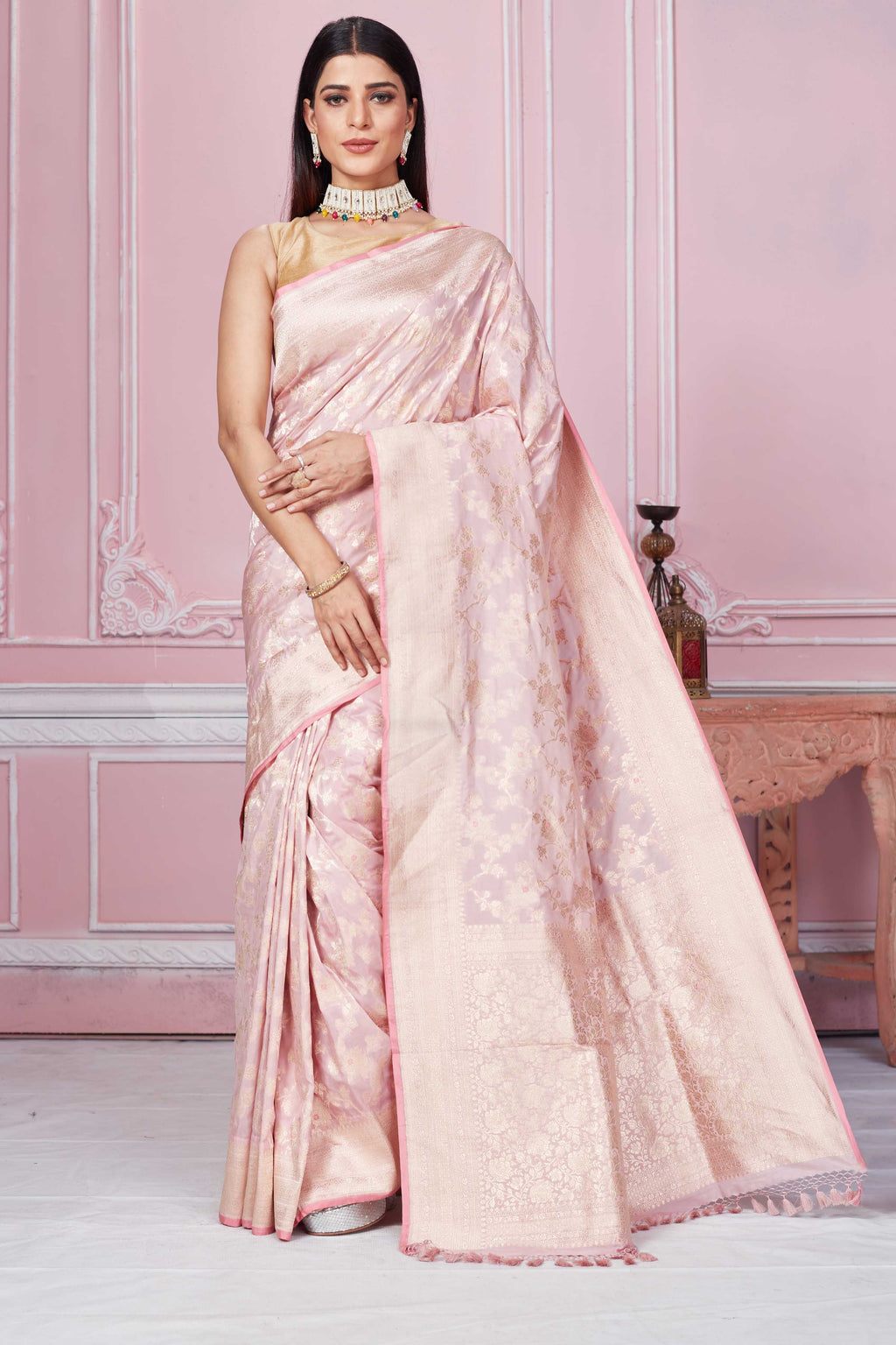 Shop powder pink Banarasi sari online in USA with floral zari jaal. Look your best on festive occasions in latest designer sarees, pure silk saris, Kanchipuram silk sarees, handwoven sarees, tussar silk saris, embroidered sarees from Pure Elegance Indian fashion store in USA.-full view