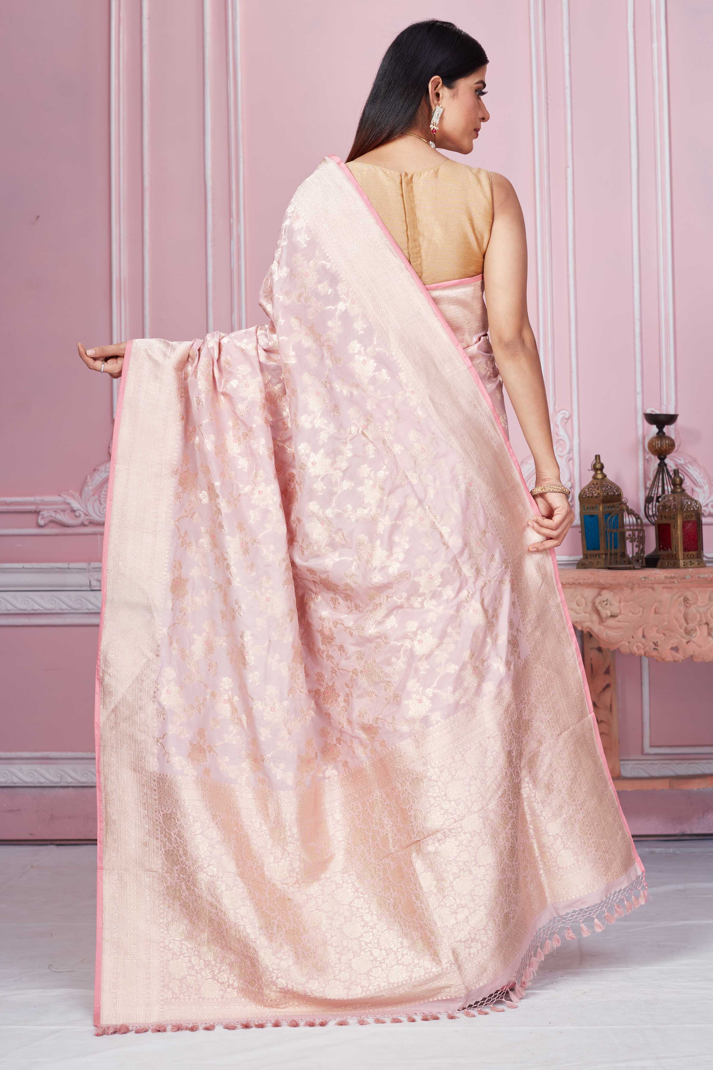 Shop powder pink Banarasi sari online in USA with floral zari jaal. Look your best on festive occasions in latest designer sarees, pure silk saris, Kanchipuram silk sarees, handwoven sarees, tussar silk saris, embroidered sarees from Pure Elegance Indian fashion store in USA.-back