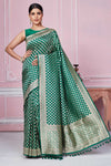 Shop dark green Banarasi sari online in USA with overall zari buta. Look your best on festive occasions in latest designer sarees, pure silk saris, Kanchipuram silk sarees, handwoven sarees, tussar silk saris, embroidered sarees from Pure Elegance Indian fashion store in USA.-full view