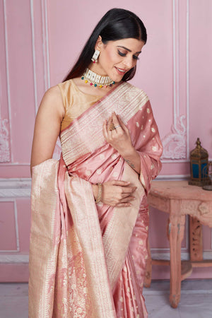 Buy dusty pink Banarasi sari online in USA with zari buta and zari border. Look your best on festive occasions in latest designer sarees, pure silk saris, Kanchipuram silk sarees, handwoven sarees, tussar silk saris, embroidered sarees from Pure Elegance Indian fashion store in USA.-closeup