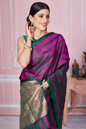 Shop purple green self stripes Banarasi sari online in USA with zari pallu. Look your best on festive occasions in latest designer sarees, pure silk saris, Kanchipuram silk sarees, handwoven sarees, tussar silk saris, embroidered sarees from Pure Elegance Indian fashion store in USA.-closeup