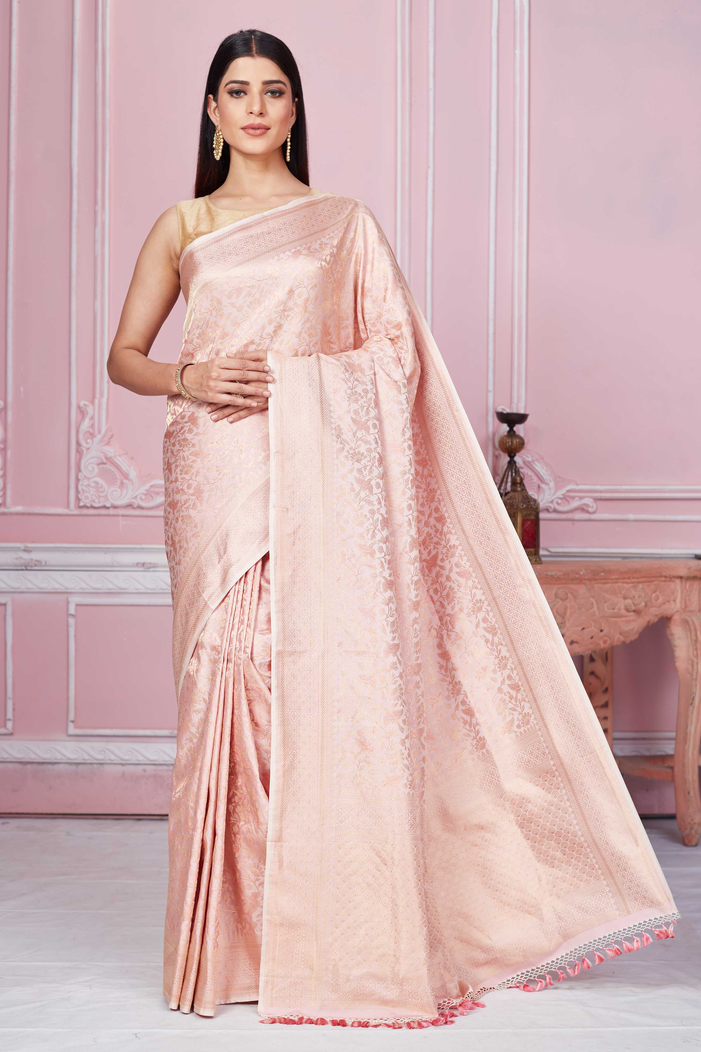 Buy powder pink Banarasi sari online in USA with overall zari jaal. Look your best on festive occasions in latest designer sarees, pure silk saris, Kanchipuram silk sarees, handwoven sarees, tussar silk saris, embroidered sarees from Pure Elegance Indian fashion store in USA.-full view
