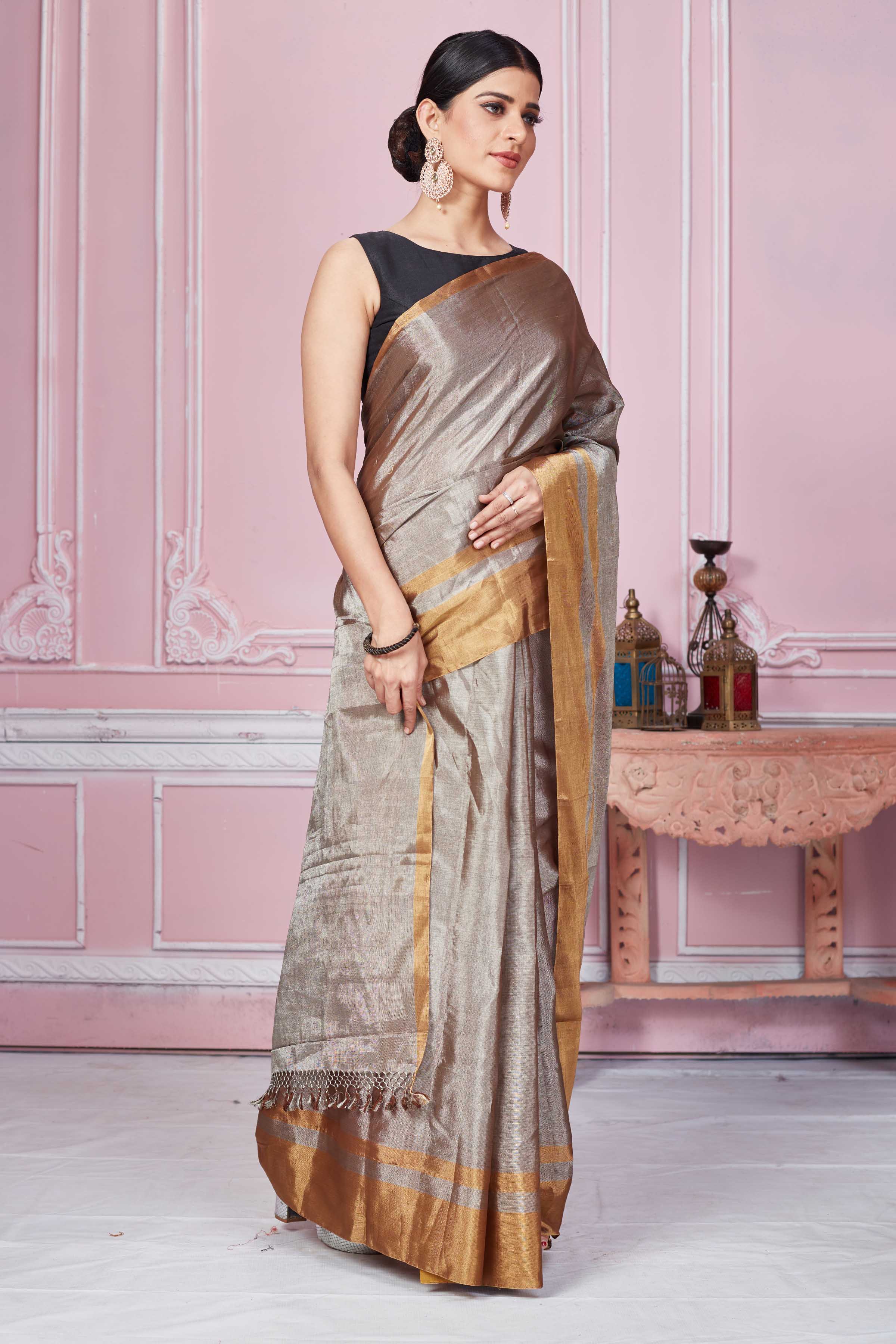 Buy metallic grey tissue Banarasi sari online in USA with golden border. Look your best on festive occasions in latest designer sarees, pure silk saris, Kanchipuram silk sarees, handwoven sarees, tussar silk saris, embroidered sarees from Pure Elegance Indian fashion store in USA.-side