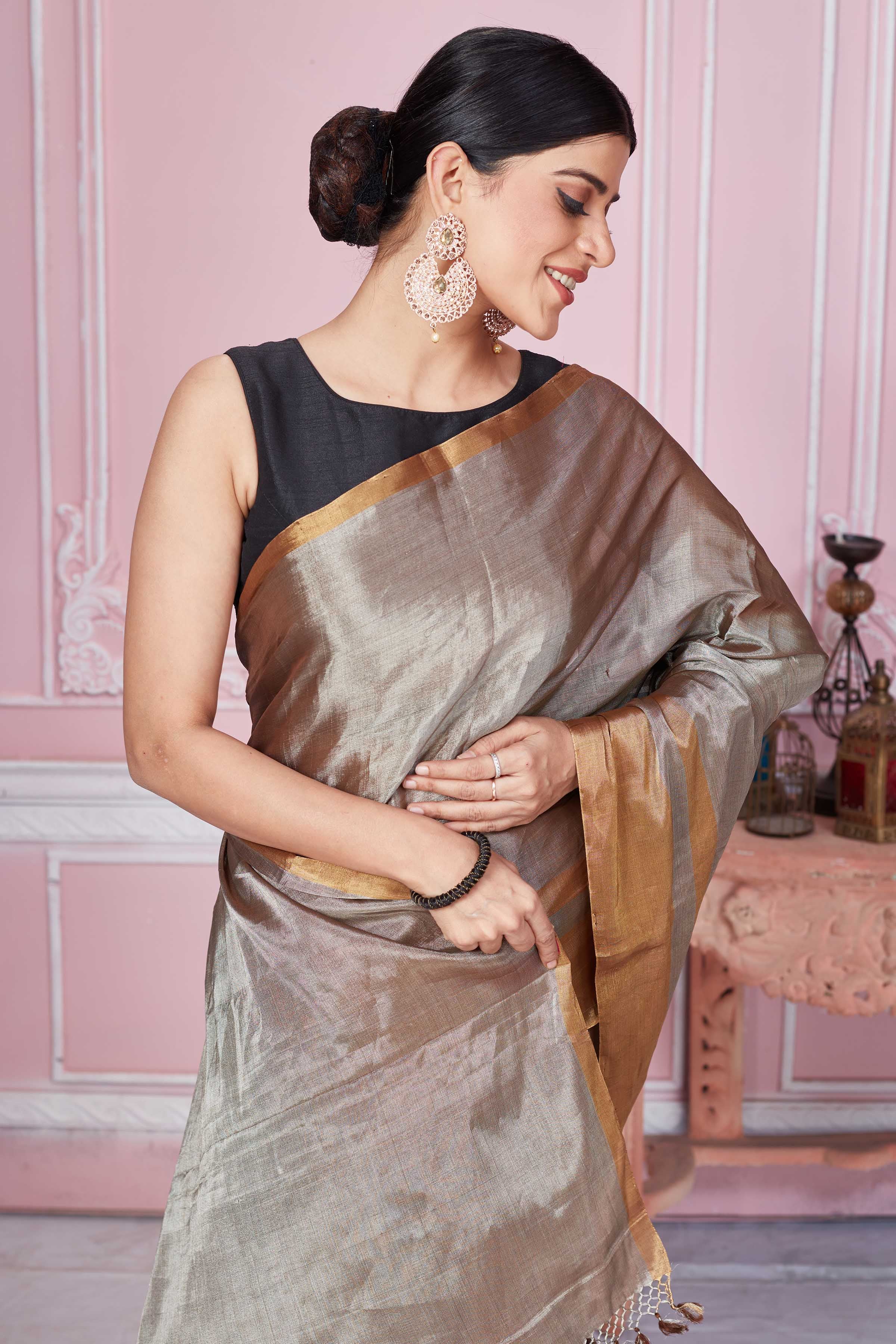 Buy metallic grey tissue Banarasi sari online in USA with golden border. Look your best on festive occasions in latest designer sarees, pure silk saris, Kanchipuram silk sarees, handwoven sarees, tussar silk saris, embroidered sarees from Pure Elegance Indian fashion store in USA.-closeup