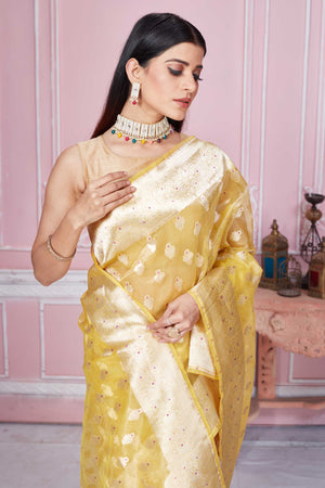 Shop yellow Banarasi sari online in USA with zari minakari buta. Look your best on festive occasions in latest designer sarees, pure silk saris, Kanchipuram silk sarees, handwoven sarees, tussar silk saris, embroidered sarees from Pure Elegance Indian fashion store in USA.-closeup