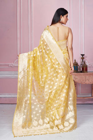 Shop yellow Banarasi sari online in USA with zari minakari buta. Look your best on festive occasions in latest designer sarees, pure silk saris, Kanchipuram silk sarees, handwoven sarees, tussar silk saris, embroidered sarees from Pure Elegance Indian fashion store in USA.-back