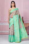 Shop grey Kora Banarasi saree online in USA with green border and pallu. Look your best on festive occasions in latest designer sarees, pure silk saris, Kanchipuram silk sarees, handwoven sarees, tussar silk saris, embroidered sarees from Pure Elegance Indian fashion store in USA.-full view