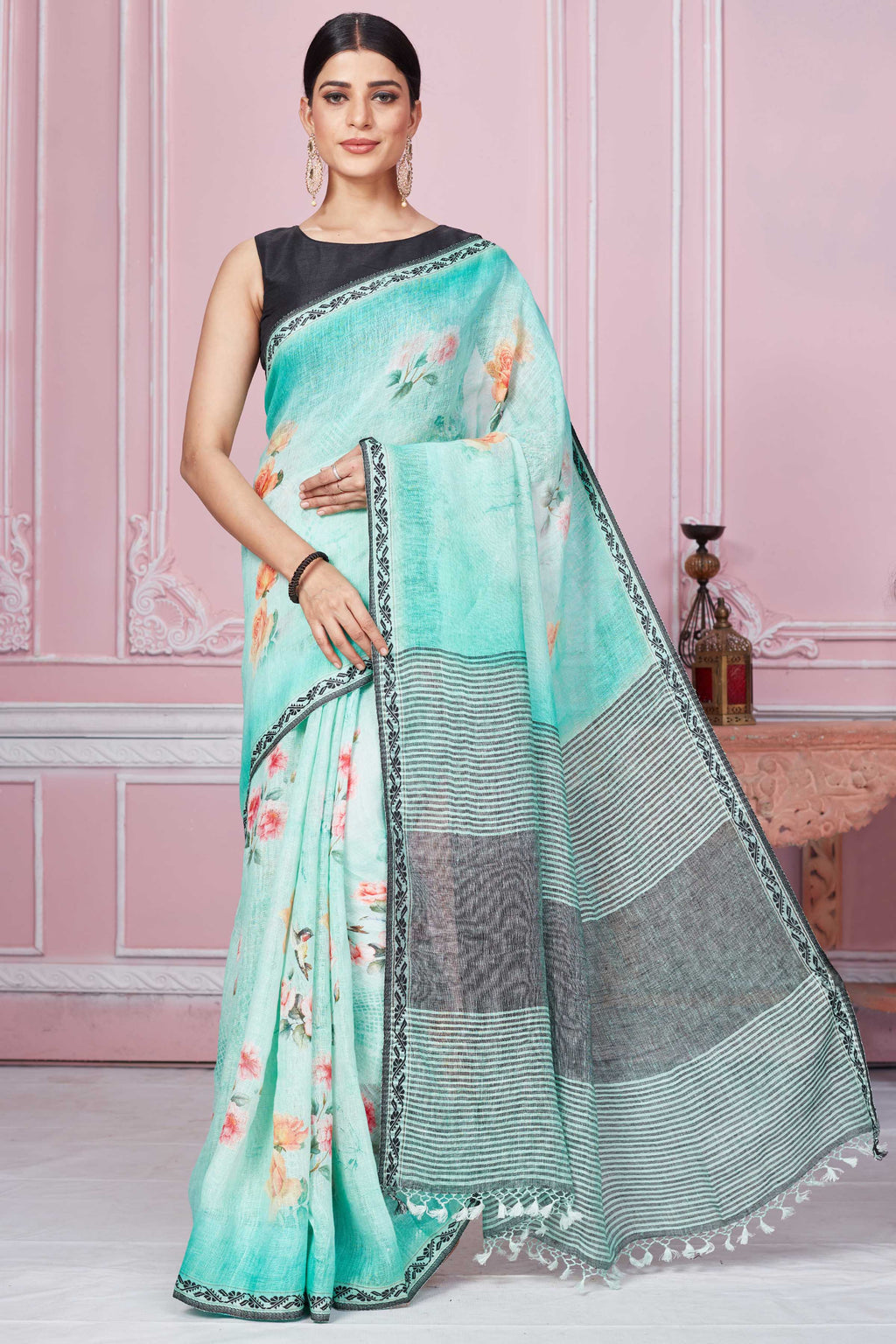 Shop pastel green floral print linen saree online in USA with striped pallu. Look your best on festive occasions in latest designer sarees, pure silk saris, Kanchipuram silk sarees, handwoven sarees, tussar silk saris, embroidered sarees from Pure Elegance Indian fashion store in USA.-full view
