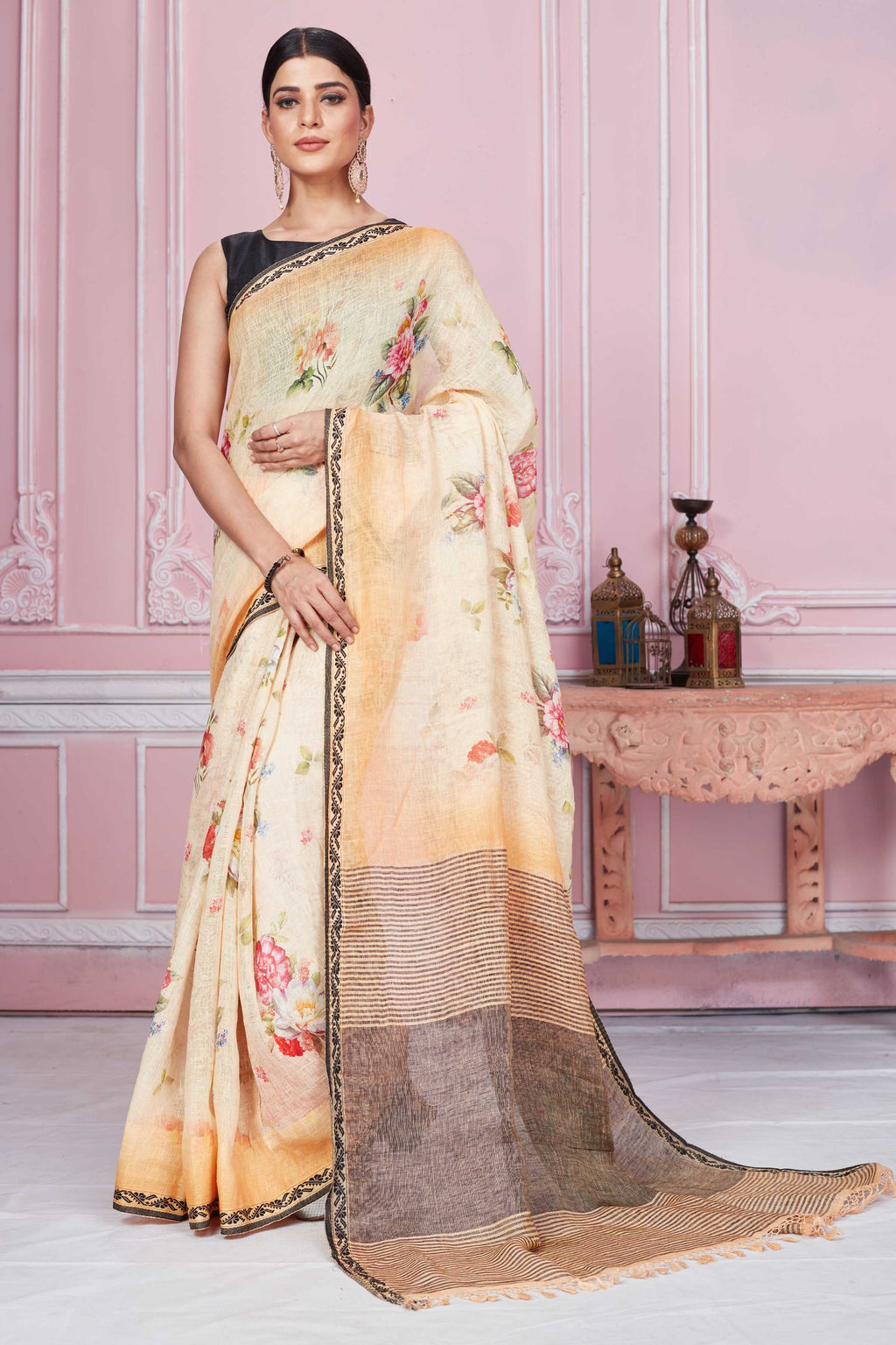 Buy peach floral print linen saree online in USA with striped pallu. Look your best on festive occasions in latest designer sarees, pure silk saris, Kanchipuram silk sarees, handwoven sarees, tussar silk saris, embroidered sarees from Pure Elegance Indian fashion store in USA.-full view
