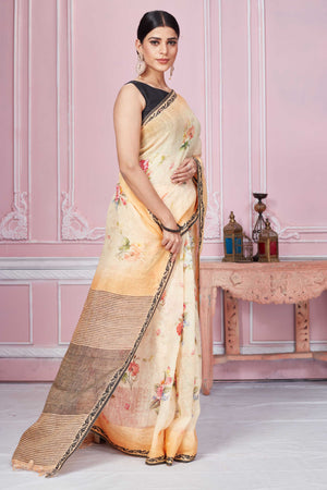 Buy peach floral print linen saree online in USA with striped pallu. Look your best on festive occasions in latest designer sarees, pure silk saris, Kanchipuram silk sarees, handwoven sarees, tussar silk saris, embroidered sarees from Pure Elegance Indian fashion store in USA.-side