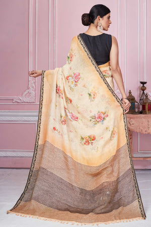 Buy peach floral print linen saree online in USA with striped pallu. Look your best on festive occasions in latest designer sarees, pure silk saris, Kanchipuram silk sarees, handwoven sarees, tussar silk saris, embroidered sarees from Pure Elegance Indian fashion store in USA.-back