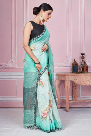 Shop stunning pastel green floral linen saree online in USA. Look your best on festive occasions in latest designer sarees, pure silk saris, Kanchipuram silk sarees, handwoven sarees, tussar silk saris, embroidered sarees from Pure Elegance Indian fashion store in USA.-side