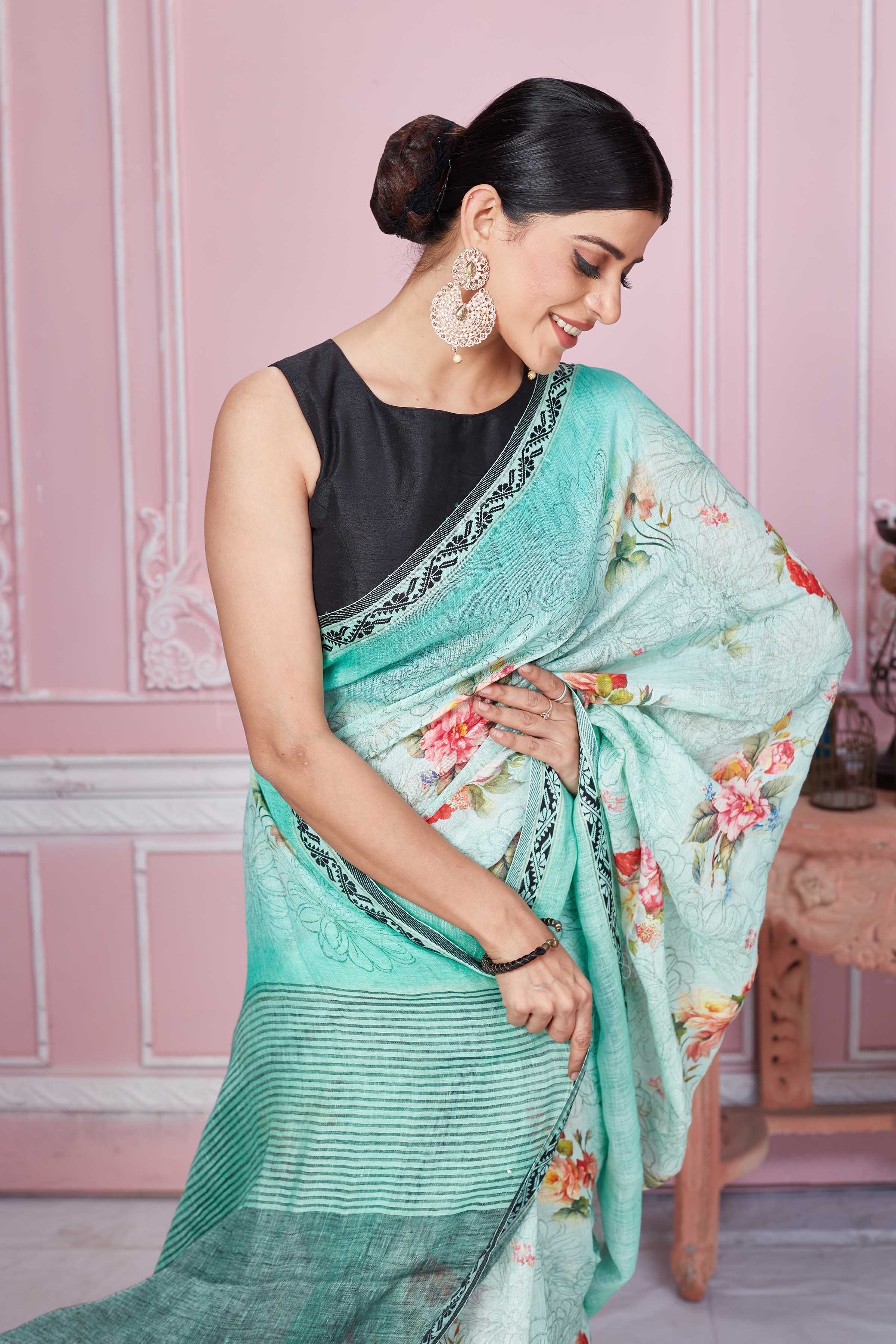 Shop stunning pastel green floral linen saree online in USA. Look your best on festive occasions in latest designer sarees, pure silk saris, Kanchipuram silk sarees, handwoven sarees, tussar silk saris, embroidered sarees from Pure Elegance Indian fashion store in USA.-closeup