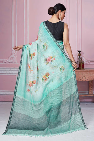 Shop stunning pastel green floral linen saree online in USA. Look your best on festive occasions in latest designer sarees, pure silk saris, Kanchipuram silk sarees, handwoven sarees, tussar silk saris, embroidered sarees from Pure Elegance Indian fashion store in USA.-back