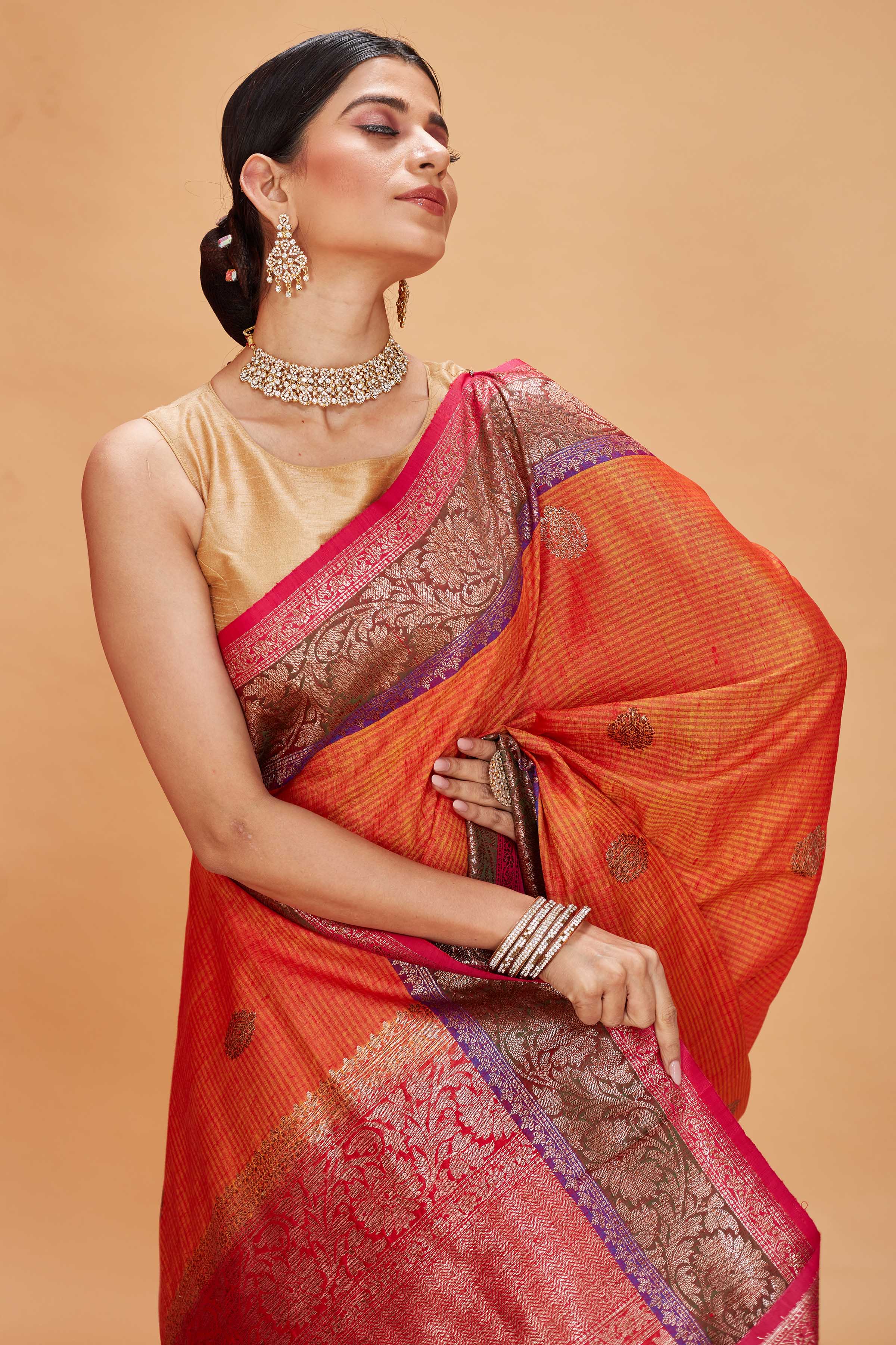 Buy orange tussar Banarasi sari online in USA with purple magenta zari border. Look your best on festive occasions in latest designer saris, pure silk sarees, Kanjivaram silk sarees, handwoven saris, tussar silk sarees, embroidered saris from Pure Elegance Indian clothing store in USA.-closeup